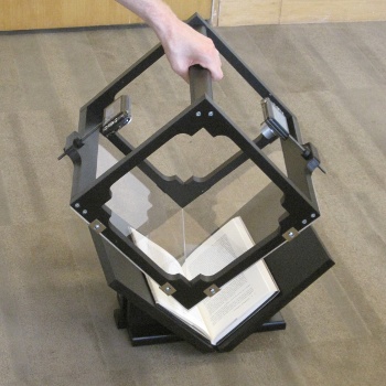 BookLiberator, with one hand lifting the top part.